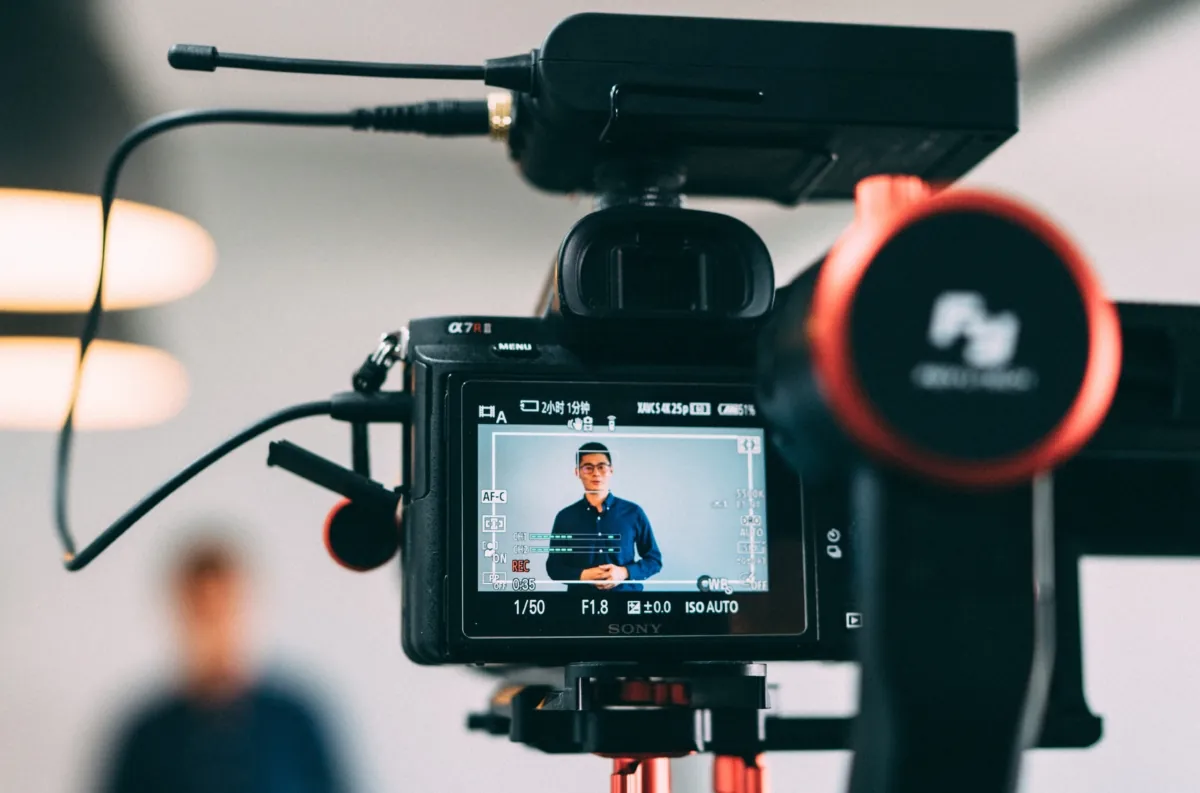 Video - closeup of a camera screen showing a man speaking