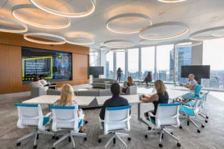 wideshot of a conference room with colleagues discussing a work-related matter