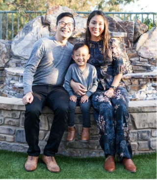 Employee experience - Asian couple posing with child