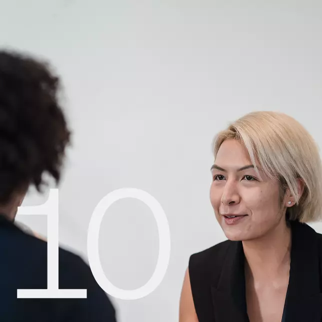 Internal communications - two female employees having a conversation