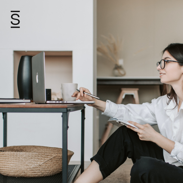 Internal communications - woman with glasses working from home on laptop computer