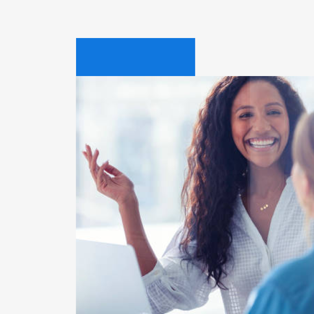 Employee experience - smiling woman hosting a meeting