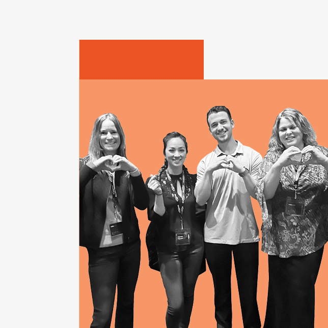 Employee communication - four employees making heart symbols with hands