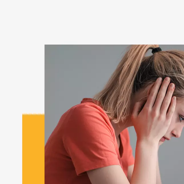 Communication mistakes - woman looking down and covering her ears