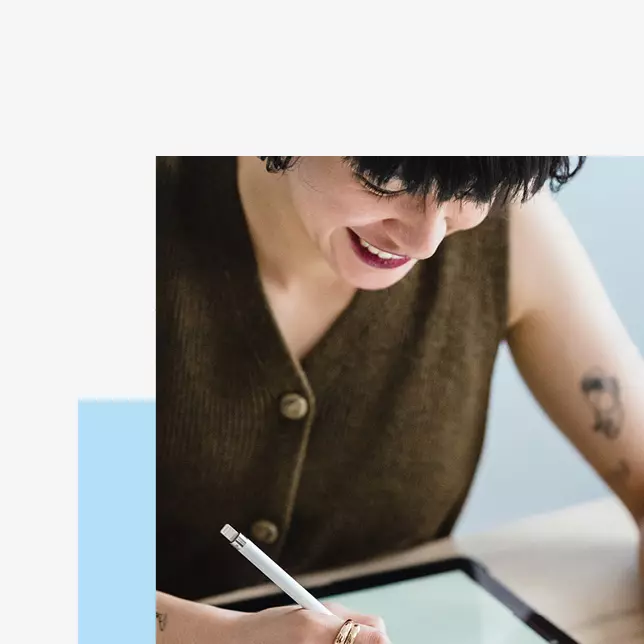 Digital employee experience - smiling woman using a tablet computer