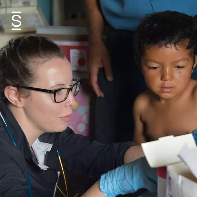 Recruitment and retention - healthcare worker speaks to a child