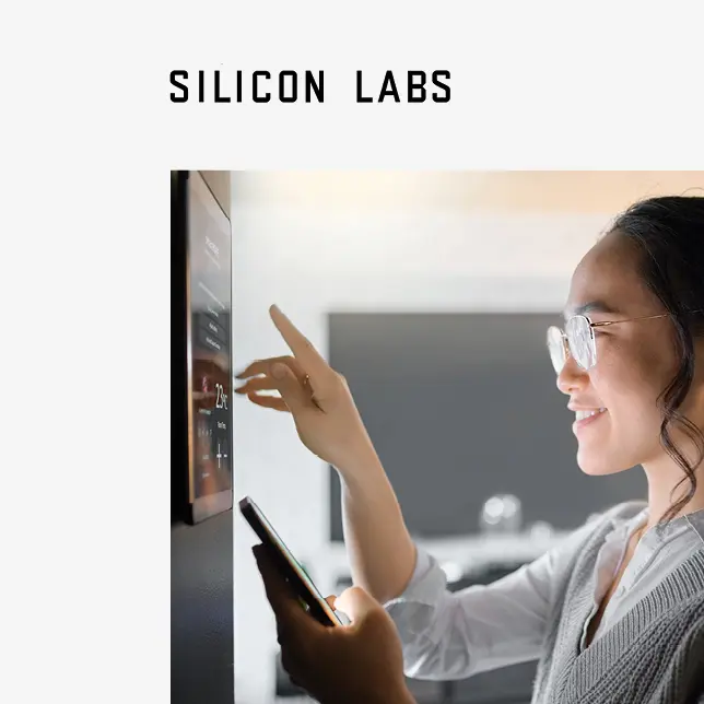 Customer case study - Silicon Labs logo above photo of woman using tablet