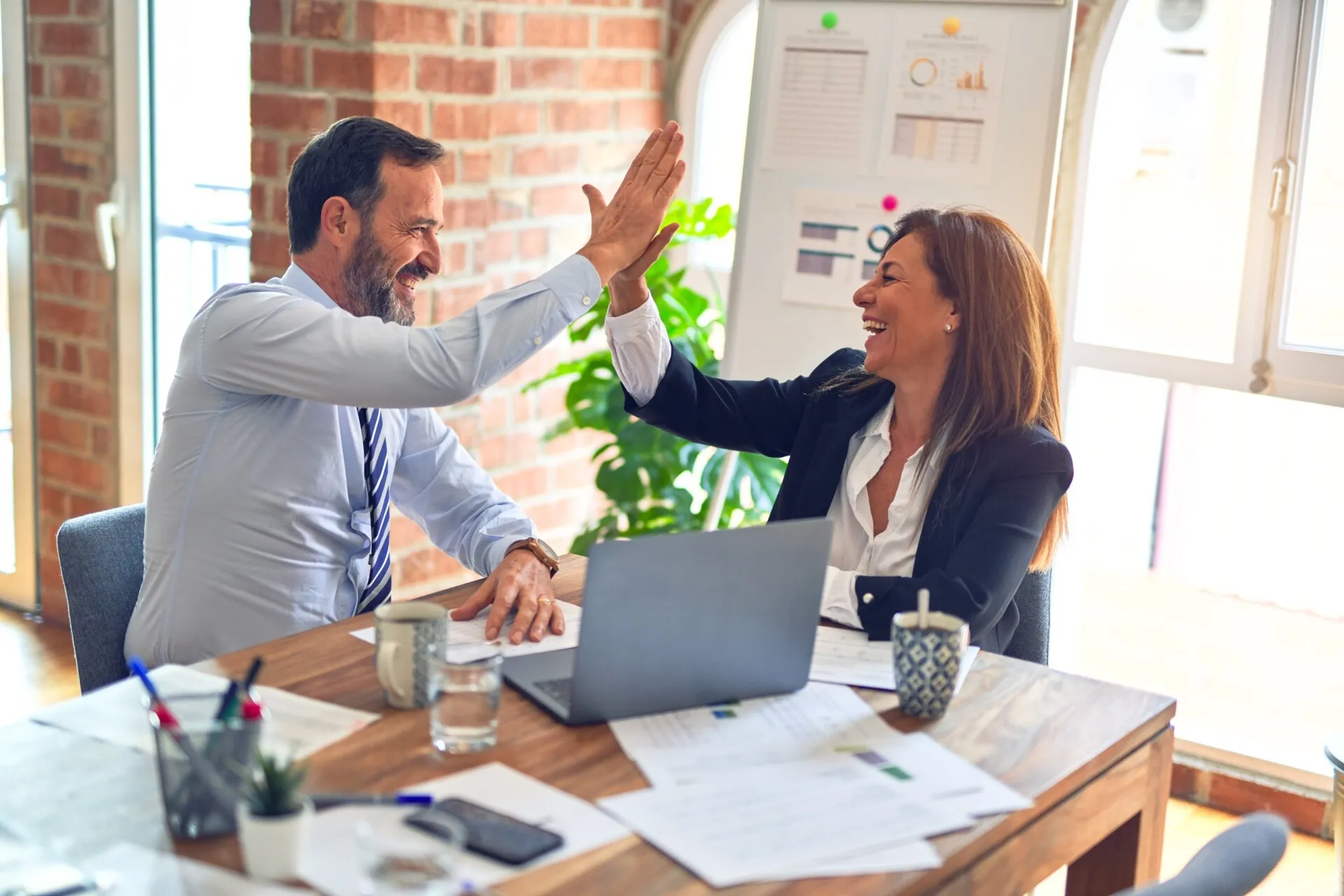 Employee experience - coworkers high-fiving