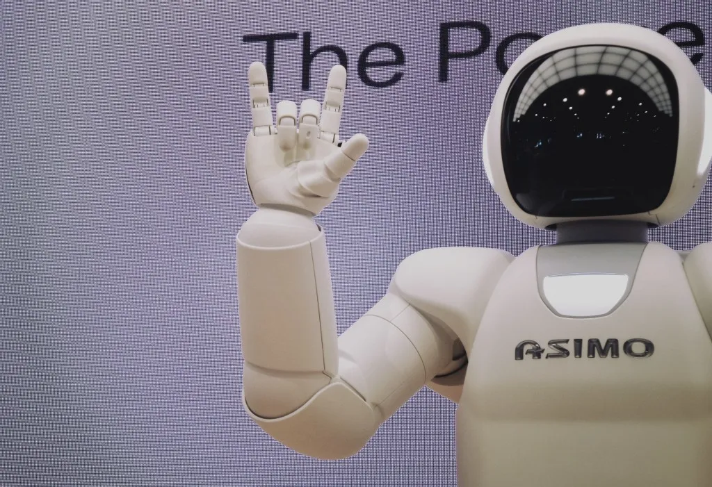 AI - Asimo robot waving at the camera