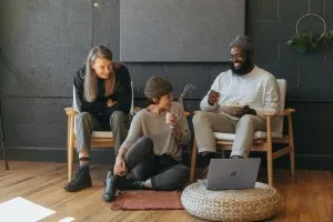 Communication barriers - three people talking and working together