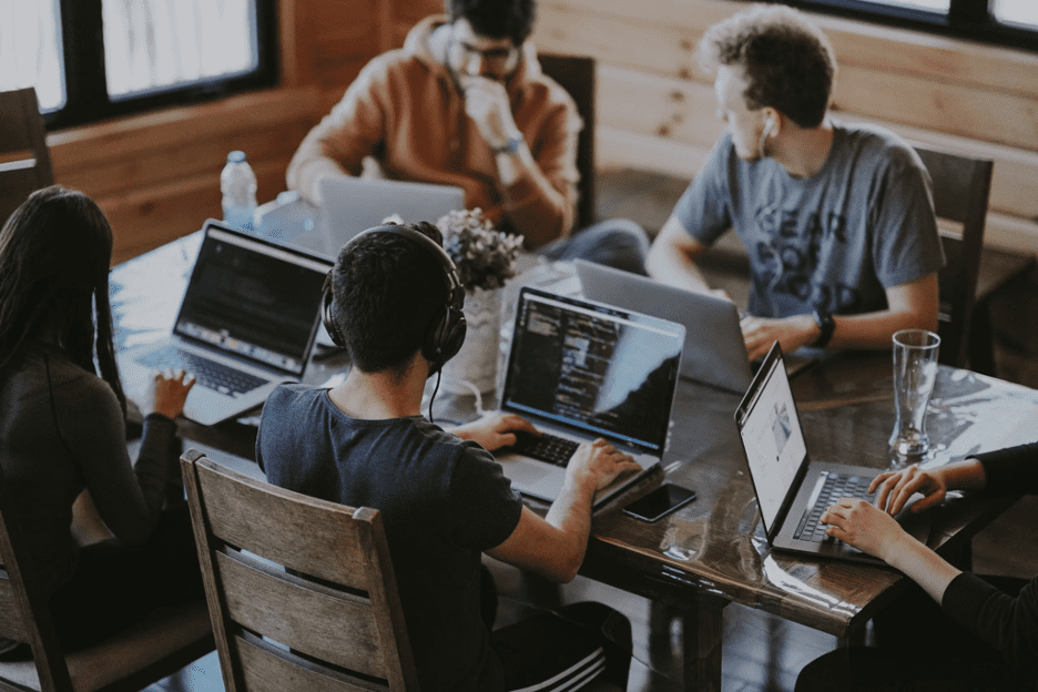 Communication software - group of employees working at a shared table